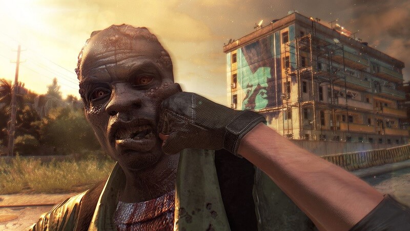 Dying Light player punching a zombie in the game